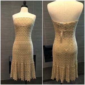 New, short, gold strapless dress.